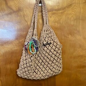 NET BEACH BAG THAT SAYS “BABE.” CUTE! INCLUDES SUNGLASSES, NAILS, & BRACELETS.